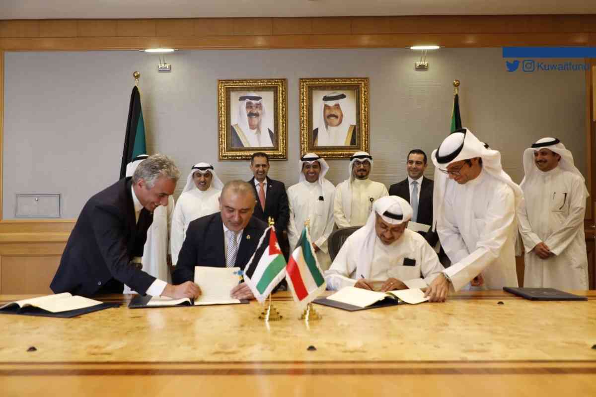 Signing a Loan Agreement to contribute to financing Sheikh Sabah Al-Ahmad Al-Sabah LNG Port in the amount of 18,200,000 Kuwaiti dinars and a Grant Agreement to finance the completion of the project for the Rehabilitation of Old Buildings and The Development of New Departments in Al-Bashir Hospital